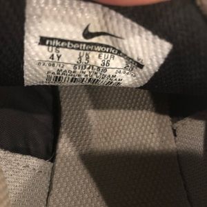 Nike boys cleats, size 4, black & silver